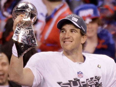 Eli Manning with Super Bowl trophy