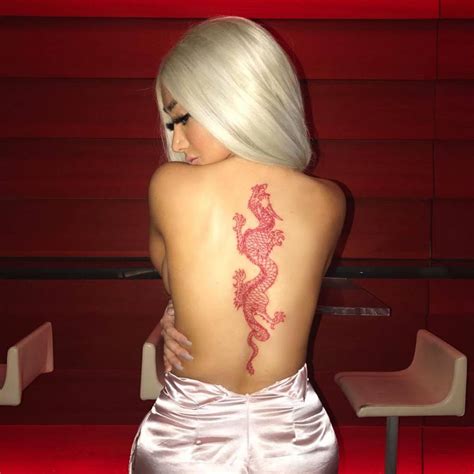 Red dragon tattoo on the back.