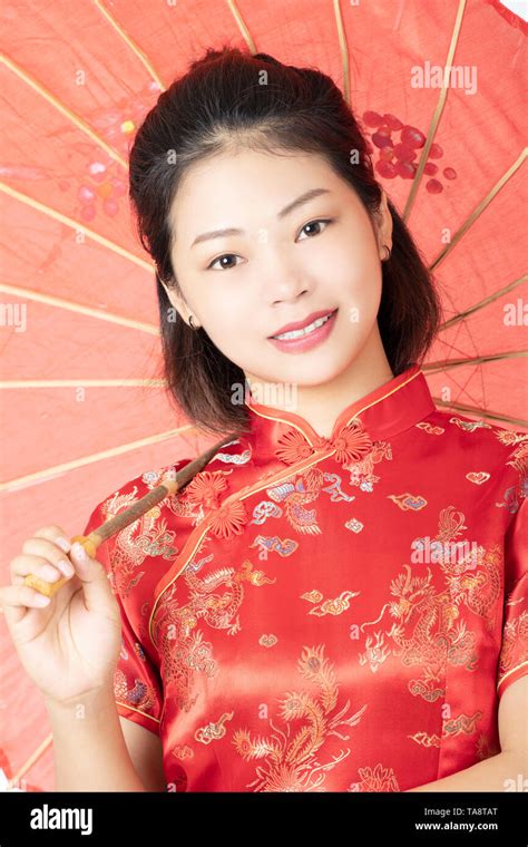 Beautiful Chinese woman wearing a traditional dress known as a ...