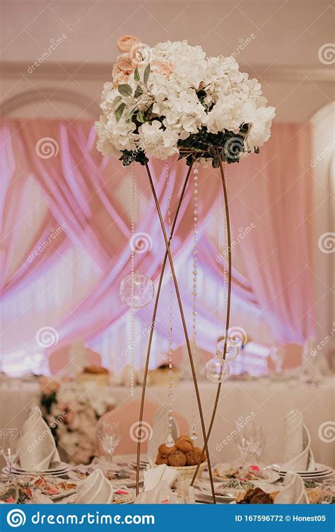 Banquet Round Tables Decorated With A Bouquet In The Center Of The ...