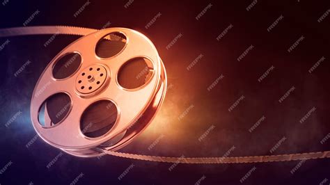 Premium Photo | Retro film reel on burn background