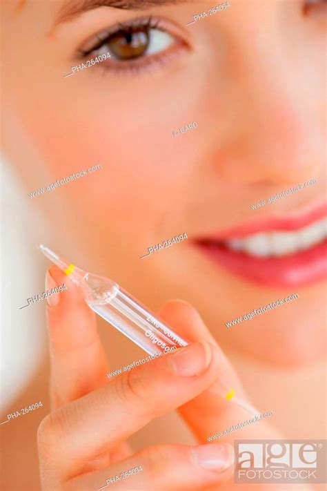 Woman holding glass ampoules of trace elements, Stock Photo, Picture And Rights Managed Image ...
