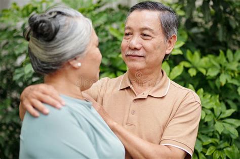 Senior Man Hugging Wife stock image. Image of retirement - 274649019