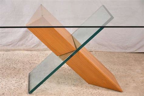 Modern style glass top table with "X" pedestal base; 697-1290 - R.H. Lee & Co. Auctioneers