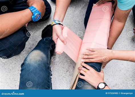 At First Aid Training Classroom, Students Are Trying To Splint The Leg Of A Patient`s Broken Leg ...