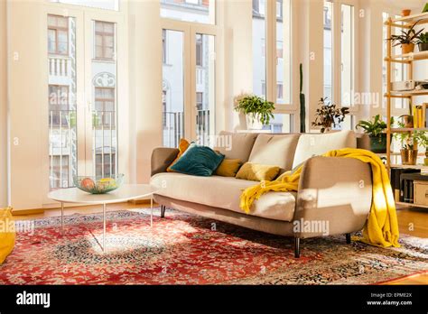 Living room area with Persian rug Stock Photo - Alamy