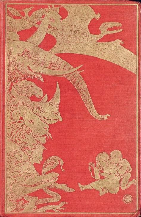 an old red book with gold foil on the cover and some animals in it's center