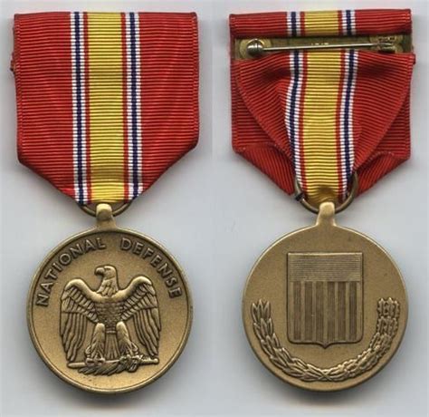 two medals, one with an eagle and the other with a flag