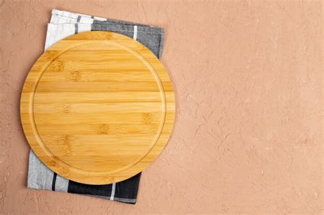 Premium Photo | Empty wooden plate on wood table Wood plate for food Flat lay Copy space