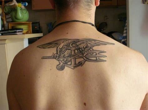 a man with a tattoo on his back