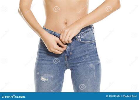 Pretty Woman Buttoning Her Jeans on White Stock Photo - Image of person ...