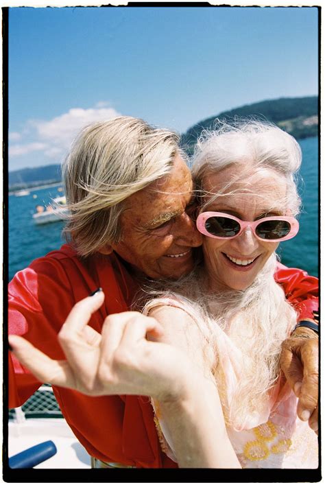 an older couple taking a selfie on a boat