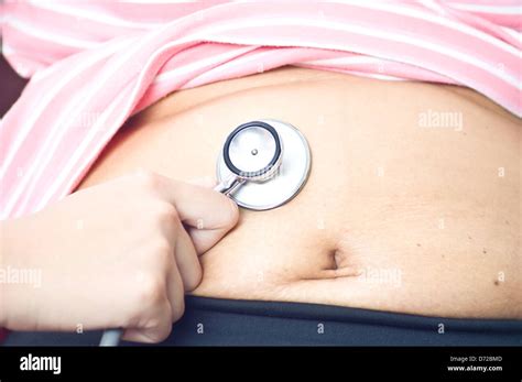 examination abdomen by doctor and use stethoscope Stock Photo - Alamy