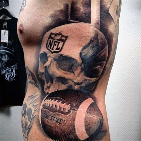 a man with a skull and football tattoo on his stomach