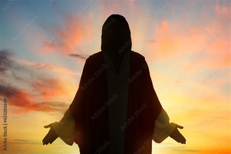 Silhouette of Jesus Christ outdoors at sunset Stock Photo | Adobe Stock