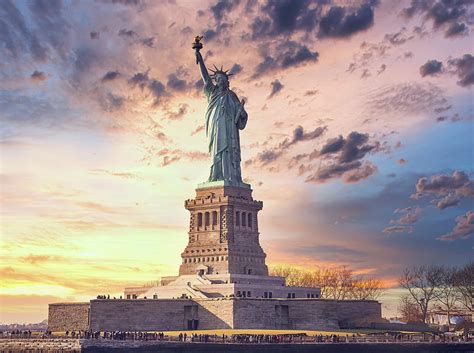 Statue of liberty at sunset Photograph by Maria Elena GARCIA - Pixels