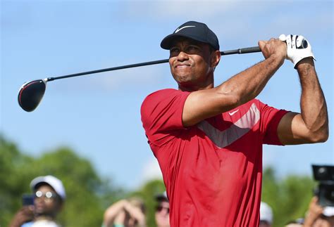 Tiger Woods starts a new year with a new look. Sun Day Red is his new apparel through TaylorMade ...