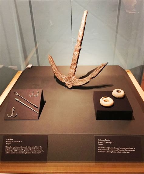 there is a display case with items on it that include an anchor and ...