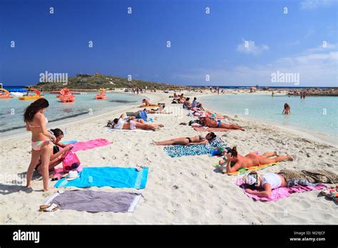 NISSI BEACH, CYPRUS - MAY 16, 2014: People relax at Nissi Beach in Cyprus. Tourism makes about ...