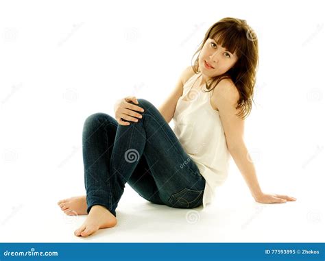 Young Woman in Jeans and Barefoot Stock Image - Image of makeup, beige: 77593895