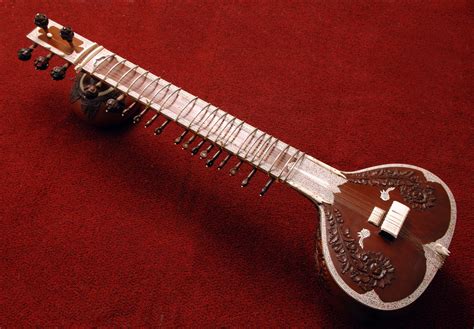 sitar noun a large, long-necked Indian lute with movable frets, played ...