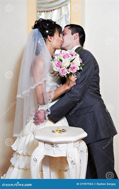 Kiss bride and groom stock photo. Image of dress, groom - 21997934