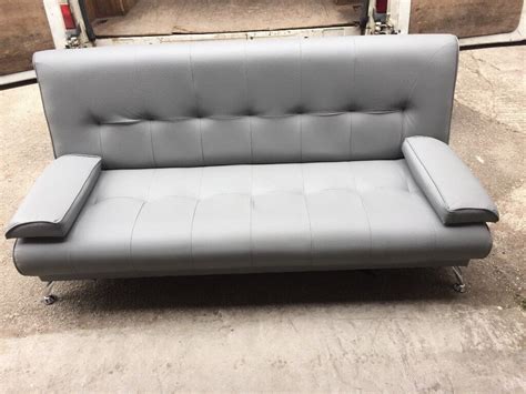 Grey leather sofa bed | in Stockport, Manchester | Gumtree