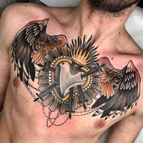 Neotraditional sacred flaming heart and wings tattoo on