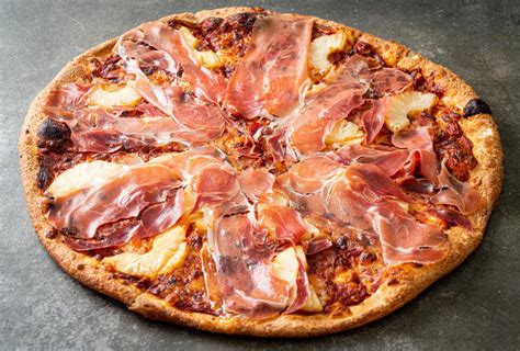 Pizza with prosciutto or parma ham pizza 3815274 Stock Photo at Vecteezy