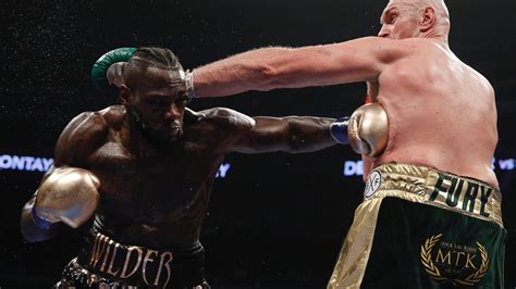 Highlights: Deontay Wilder Retains His Title Via Split Draw With Tyson ...