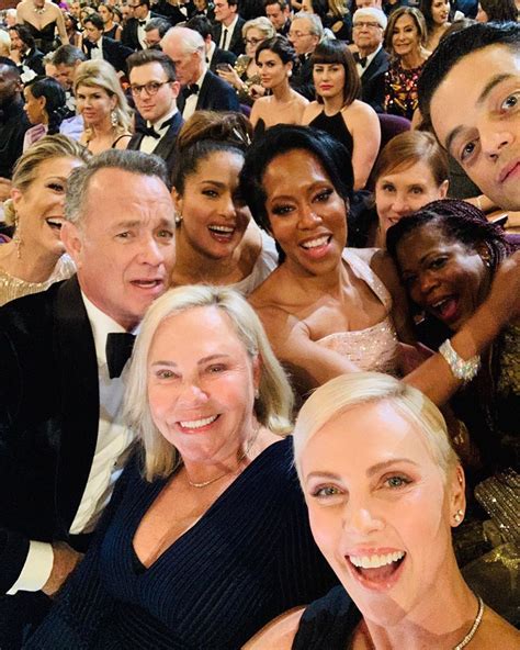 Charlize Theron Takes Epic Oscars Selfie with Tom Hanks, Salma Hayek ...