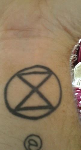 Extinction symbol tattoo. | Extinction symbol tattoo, by @On… | Flickr