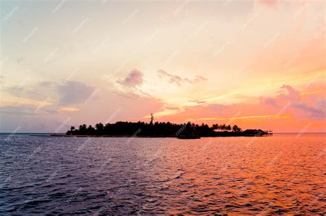 Premium Photo | Sunset sky with maldives island