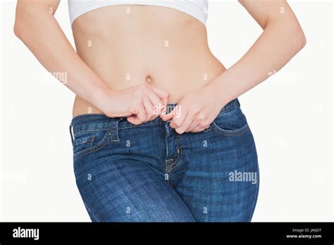 Woman Buttoning Jeans Stock Photos & Woman Buttoning Jeans Stock Images ...