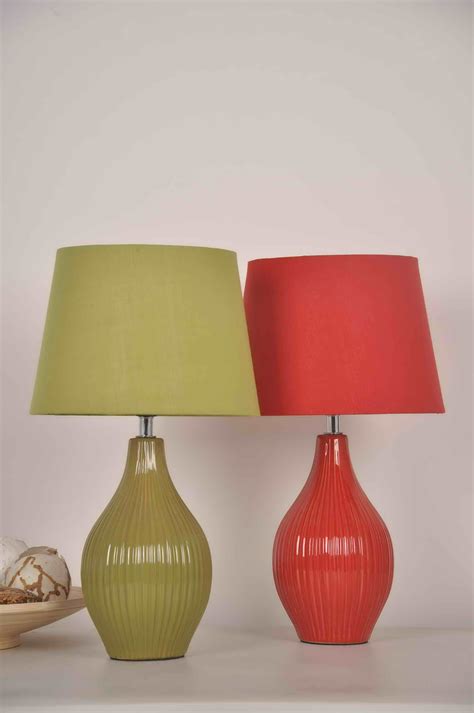 two lamps sitting next to each other on a table