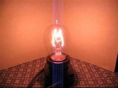 Antique carbon-filament light bulb--Variac test - YouTube