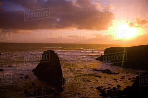 Rocky Coastline At Sunset - Stock Photo - Dissolve