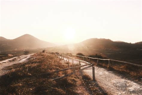 Download Aesthetic Light Brown Sunlight Over Mountains Wallpaper ...