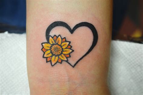 Share more than 79 sunflower heart tattoo best - in.cdgdbentre