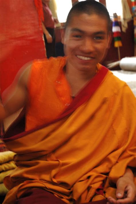 Smiling, a Tibetan Buddhist monk drummer's downstroke, in … | Flickr