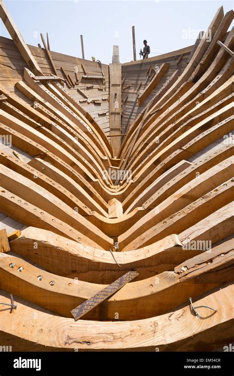 detail of keel construction of a traditional wooden dhow cargo ship being built in shipyard ...