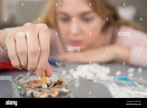 Woman cigarette garbage hi-res stock photography and images - Alamy