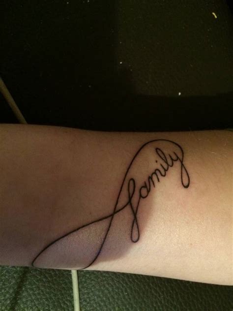 Family infinity symbol tattoo on the right forearm.