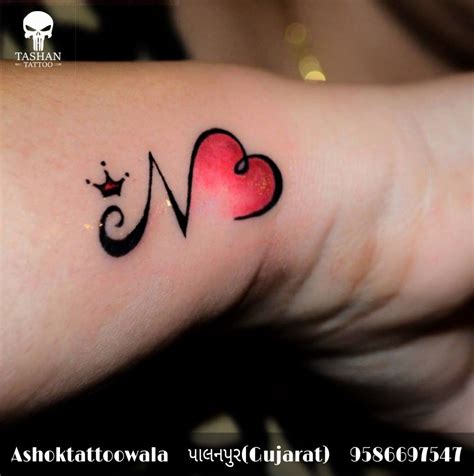 N heart tattoo || Om Tattoo Design, Tattoo Lettering Design, Finger ...