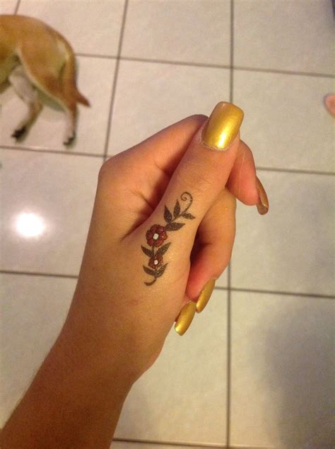 Flower thumb Tattoo | Thumb tattoos, Writer tattoo, Tattoos