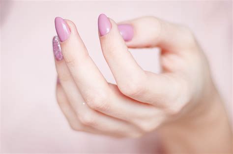Person's Hand With Pink Manicure · Free Stock Photo