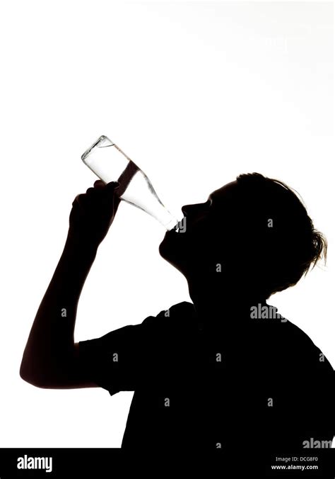 silhouette of a man drinking Stock Photo - Alamy