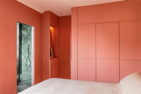 Peachy Picture Molding Conceals a Walk-In Closet in This Paris Apartment