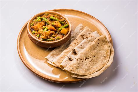 Premium Photo | Indian mixed veg containing potato and beans with ...