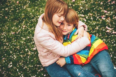 Two Little Kids Playing Together Outside Stock Photo - Image of cool, brother: 109889950